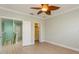Comfortable bedroom features closet with plenty of storage and a wood-look floor at 7313 Gaberia Rd, Trinity, FL 34655