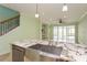 Kitchen island featuring a stainless steel sink and granite countertops at 7313 Gaberia Rd, Trinity, FL 34655