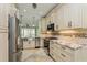 Kitchen featuring stainless steel appliances, granite countertops and custom cabinetry at 7313 Gaberia Rd, Trinity, FL 34655