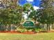 Welcoming community entrance sign for The Sabals Townhomes surrounded by lush landscaping at 7313 Gaberia Rd, Trinity, FL 34655