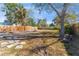 Spacious backyard with a fire pit, surrounded by fencing for privacy and relaxation at 812 52Nd S Ave, St Petersburg, FL 33705