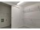 Walk-in closet with built-in wire shelving for organization at 8914 N Ola Ave, Tampa, FL 33604