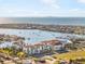 Aerial view of waterfront homes and community with city skyline in the distance at 1026 Bellasol Way # 4403, Apollo Beach, FL 33572
