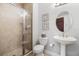 Bathroom featuring glass-enclosed shower and a pedestal sink at 1026 Bellasol Way # 4403, Apollo Beach, FL 33572
