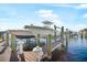 View of private boat dock and boats on a sunny day at 1026 Bellasol Way # 4403, Apollo Beach, FL 33572