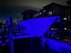 Night view of the covered boat lift, with water access and nearby building at 1026 Bellasol Way # 4403, Apollo Beach, FL 33572