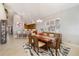 Spacious dining room connected to the kitchen with a modern rug and a large window providing natural light at 1026 Bellasol Way # 4403, Apollo Beach, FL 33572