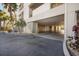 Under building garage features multiple parking spaces with block construction and adjacent landscaping at 1026 Bellasol Way # 4403, Apollo Beach, FL 33572