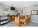 Community kitchenette area features a bar with seating, refrigerator, and sink at 1026 Bellasol Way # 4403, Apollo Beach, FL 33572