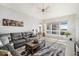 Bright living room with neutral tones, comfortable seating, and large windows offering ample natural light at 1026 Bellasol Way # 4403, Apollo Beach, FL 33572