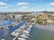 Aerial view of a marina with many boats docked on the water with city views in the distance at 1026 Bellasol Way # 4403, Apollo Beach, FL 33572