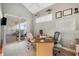 Well-lit home office with a balcony and comfortable seating at 1026 Bellasol Way # 4403, Apollo Beach, FL 33572