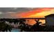 Beautiful sunset over the water with palm trees in the foreground at 1026 Bellasol Way # 4403, Apollo Beach, FL 33572