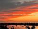 Beautiful sunset view of the harbor featuring orange and yellow cloud colors at 1026 Bellasol Way # 4403, Apollo Beach, FL 33572