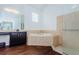 Bathroom featuring a separate shower, and a sink with dark cabinetry at 10312 Riverburn Dr, Tampa, FL 33647