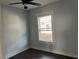 Small bedroom with window, hardwood flooring, and neutral color palette at 112 E Emily St, Tampa, FL 33603