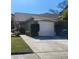 Charming single-story home with a well-maintained lawn and a two-car garage at 11638 Hidden Hollow Cir, Tampa, FL 33635