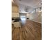 Open-concept living area with fireplace, hardwood floors, and sliding glass doors at 11638 Hidden Hollow Cir, Tampa, FL 33635