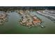 Picturesque aerial view of waterfront community with private docks, charming homes, and serene waterways at 11697 Grove St, Seminole, FL 33772
