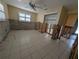 Bright bedroom under renovation with tiled flooring and ceiling fan at 11697 Grove St, Seminole, FL 33772