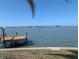 Private boat dock with picturesque waterfront views offering the perfect spot for relaxation at 11697 Grove St, Seminole, FL 33772