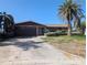 Charming single-story brick home with a two-car garage and mature landscaping at 11697 Grove St, Seminole, FL 33772