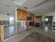 Spacious kitchen under renovation with cabinet and tiled floor at 11697 Grove St, Seminole, FL 33772