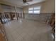 Renovated room featuring tiled floors, natural light and updated finishes at 11697 Grove St, Seminole, FL 33772