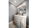 Charming bathroom featuring modern lighting, neutral colors, marble countertop, and a modern sink at 13225 108Th Ave, Largo, FL 33774