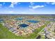 Aerial view showcases a home with a screened pool in a community near a lake at 13235 Graham Yarden Dr, Riverview, FL 33579