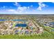 Neighborhood aerial view showcases property with screened pool and backyard in a community near a lake at 13235 Graham Yarden Dr, Riverview, FL 33579