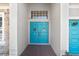 Inviting double doors, a stylish entrance to the home, decorated with wreaths at 13235 Graham Yarden Dr, Riverview, FL 33579