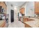 Modern kitchen with granite countertops, stainless steel appliances, and ample cabinet space at 13235 Graham Yarden Dr, Riverview, FL 33579