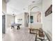 Open-concept living room featuring hardwood floors, high ceilings, and stylish archways at 13235 Graham Yarden Dr, Riverview, FL 33579