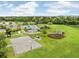 Community pool and recreation area with a basketball court, gazebo and ample green space at 13235 Graham Yarden Dr, Riverview, FL 33579