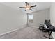 Cozy bedroom features a ceiling fan, a window with blinds, and carpet flooring at 1454 Tahitian Sunrise Dr, Plant City, FL 33565