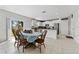 Eat-in kitchen area featuring stainless steel appliances, pantry, and sliding glass doors at 1454 Tahitian Sunrise Dr, Plant City, FL 33565