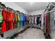 Spacious walk-in closet with built-in shelving and ample hanging space for clothes and shoes at 1454 Tahitian Sunrise Dr, Plant City, FL 33565
