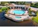Aerial view of the lavish pool, waterfront with boat dock and scenic landscaping at 15 Jefferson S Ct, St Petersburg, FL 33711