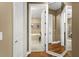 Bathroom with a large tub and a separate shower, view through doorway at 15 Jefferson S Ct, St Petersburg, FL 33711