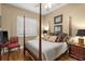 Bedroom featuring a four post bed, wood flooring, and natural light at 15 Jefferson S Ct, St Petersburg, FL 33711