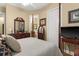Bedroom featuring a bed, wood flooring, and doorway to an ensuite bathroom at 15 Jefferson S Ct, St Petersburg, FL 33711