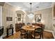 Elegant dining room with hardwood floors, a chandelier, and comfortable seating at 15 Jefferson S Ct, St Petersburg, FL 33711