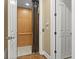 Elevator inside home, open door shows tile floor, wood paneled interior at 15 Jefferson S Ct, St Petersburg, FL 33711