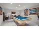 This spacious game room is highlighted by a pool table and vintage artwork at 15 Jefferson S Ct, St Petersburg, FL 33711