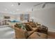 This living room features a comfortable sectional sofa and a pool table for entertainment at 15 Jefferson S Ct, St Petersburg, FL 33711