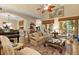 Open living room with a high ceiling, hardwood floors, elegant furniture, and access to the patio at 15 Jefferson S Ct, St Petersburg, FL 33711