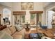Well-decorated living room with hardwood floors, large windows, and access to the outdoor patio at 15 Jefferson S Ct, St Petersburg, FL 33711