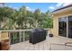 This home's outdoor patio has a grill and is surrounded by lush greenery at 15 Jefferson S Ct, St Petersburg, FL 33711
