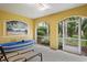 This home features a cozy patio area with a painted mural and lush landscaping at 15 Jefferson S Ct, St Petersburg, FL 33711